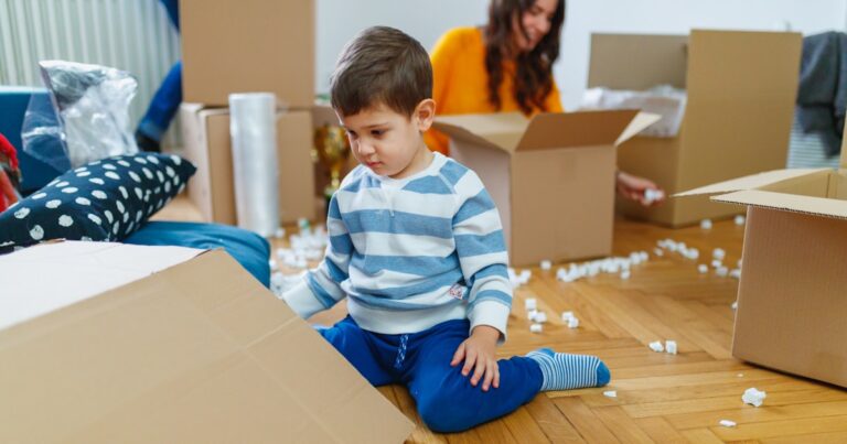 toddler sitting on parquet