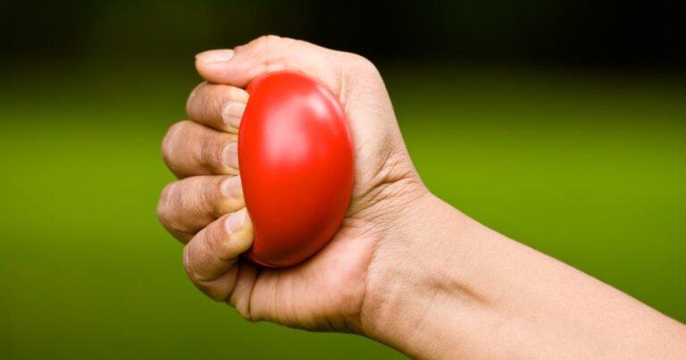 hand squeezing a stress